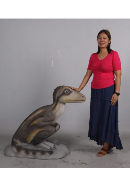 Juvenile Theropod Sitting Dinosaur Statue